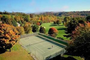 an overhead view of a tennis court with two people on it at Kingswood 6E in Quechee