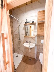 a bathroom with a sink and a toilet at Village Vista in Rob +62 photos