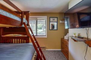 a bedroom with two bunk beds and a television at Dover Green 15F in Dover