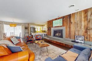 a living room with a couch and a fireplace at Fawn Ledge in Jamaica