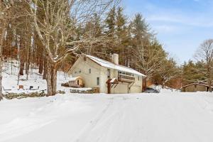 a house in the snow in a snowy field at Fawn Ledge in Jamaica