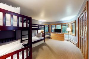 a bedroom with two bunk beds and a desk at Birch Landing #1 in Plymouth +68 photos