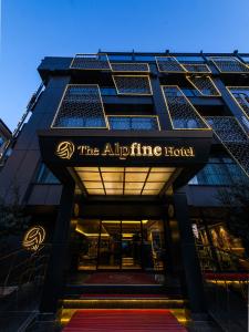 a building with a sign that reads the air filling hotel at The Alpfine Hotel in Ankara