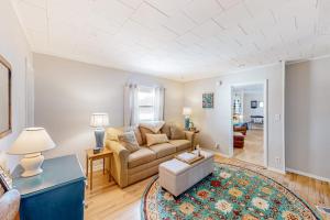 a living room with a couch and a table at Maplewood Manor - Unit 2 in Colchester
