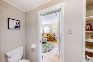 a bathroom with a toilet and a living room at Maplewood Manor - Unit 2 in Colchester +64 photos