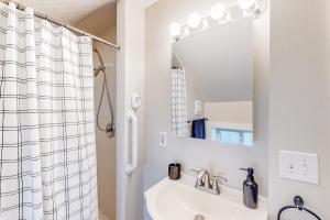 a bathroom with a sink and a mirror at Maplewood Manor - Unit 1 in Colchester +67 photos