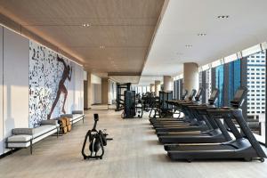 a gym with treadmills and elliptical machines at Sheraton Vinh in Yên Thinh (1)