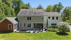 a large house with a patio and a yard at KPT Salt Pine House Apartment in Kennebunkport