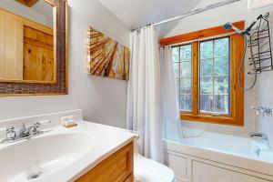 a bathroom with a sink and a tub and a toilet at Meet Me At Our Spot in Moretown +42 photos