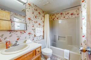 a bathroom with a sink and a toilet and a shower at Snow Tree 32A in Dover +42 photos