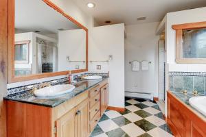 a bathroom with two sinks and a large mirror at Sweet Berry Farm in Jamaica +90 photos
