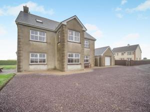 a large house with a driveway in front of it at 4 Bed in Schull oc-ii09887 in Schull