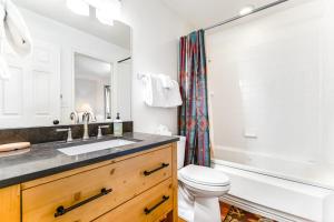 a bathroom with a sink and a toilet and a shower at Solano Vallejo 3288 in Moab +23 photos