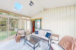 a living room with a couch and a table at Malletts Bay Getaway in Colchester