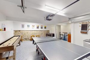 a room with a ping pong table and a ping pong table at The Worden House in Manchester