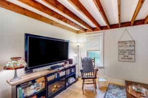 a living room with a large flat screen tv at Cozy Modern Farmhouse in Wallingford