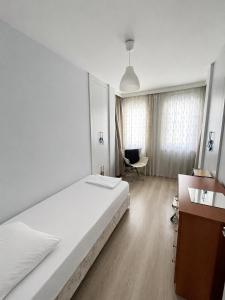 a bedroom with a bed and a desk and a chair at Private Pool Home at Dalyan in Ortaca +55 photos