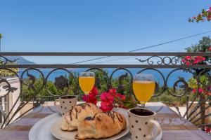 a table with bread and two glasses of wine at Apartments Oktopus in Sutomore