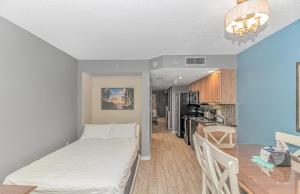 a small room with a bed in a kitchen at Atlantica 1055 in Myrtle Beach