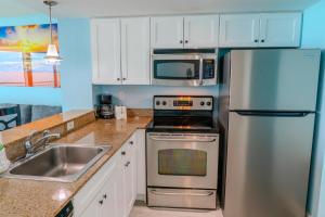 a kitchen with a stainless steel refrigerator and a sink at Sandy Beach 1612 in Myrtle Beach