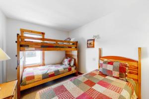 a bedroom with two bunk beds and a bed at Jay Peak Village Home 367A&B in Jay +78 photos