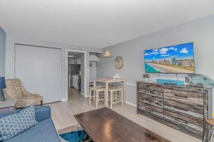 a living room with a couch and a table at Boardwalk 439 & 440 in Myrtle Beach