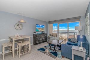 a living room with a desk and a dining room at Boardwalk 439 & 440 in Myrtle Beach