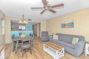 a living room with a couch and a table at Atlantica 757 in Myrtle Beach