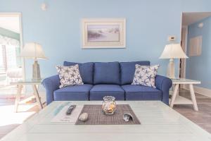 a blue living room with a blue couch at The Palace 1513 in Myrtle Beach