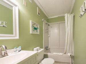 a bathroom with a sink and a toilet and a shower at A Place at the Beach 406 in Myrtle Beach