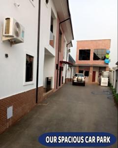 a car parked in a parking lot next to a building at Britney Luxury Apartment in Irete +6 photos