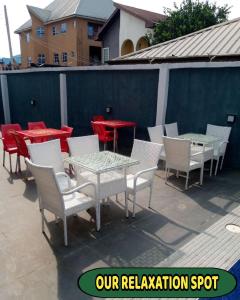 a group of tables and chairs on a patio at Britney Luxury Apartment in Irete