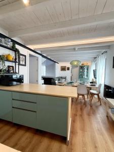 a kitchen and dining room with a large wooden counter top at Posadas de Marí Casa Andreea 6 in Talavera de la Reina +27 photos