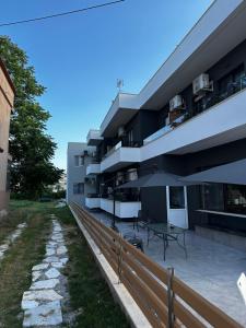 an external view of a building with a patio at Golden Sands in Keramoti