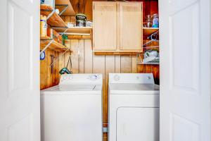 a washer and dryer in a small kitchen at The Seashell Cottage in Ocean City +21 photos