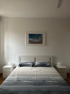 a bedroom with a large bed with two night stands at La casetta sul mare in Ortona