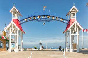 a sign that reads welcome to the beach at White Marlin 209B in Ocean City +21 photos