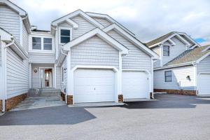 a large white house with two garage doors at Sunset Harbour B in Ocean City +16 photos