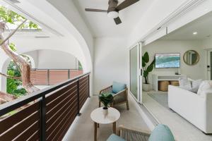 a living room with a couch and a table at Casa Luz - Sunlit Boca Pool Retreat in Boca Raton +34 photos