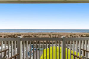 a balcony with a view of the beach at Beach Village 6 in Ocean City