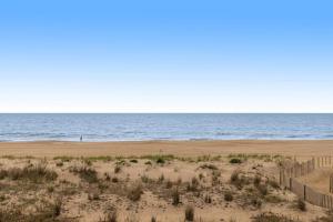 an empty beach with the ocean in the background at Beach Village 6 in Ocean City