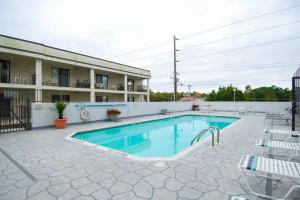 a swimming pool in front of a building at Waikiki 102 in Ocean City