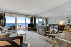 a living room with a view of the ocean at El Capitan 403 in Ocean City