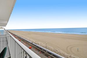 a view of the beach from a balcony at El Capitan 403 in Ocean City