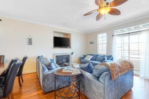 a living room with two couches and a fireplace at Saint Louis Ave, Unit D in Ocean City