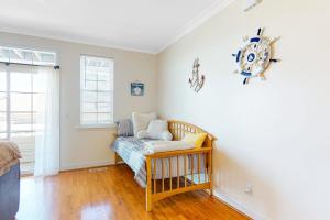 a room with a couch and a clock on the wall at Saint Louis Ave, Unit D in Ocean City +17 photos