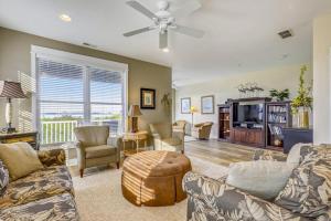 a living room with a couch and a tv at 13009 Bowline Ln 1 in Ocean City