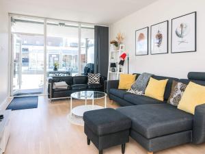 a living room with a couch and a table at 5 star holiday home in Ringkøbing in Ringkøbing