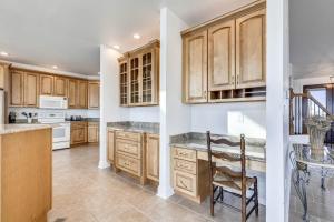 a kitchen with wooden cabinets and a counter top at Sunset Getaway in Ocean City