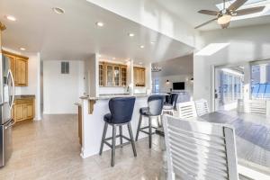 a kitchen and dining room with a table and chairs at Sunset Getaway in Ocean City +46 photos